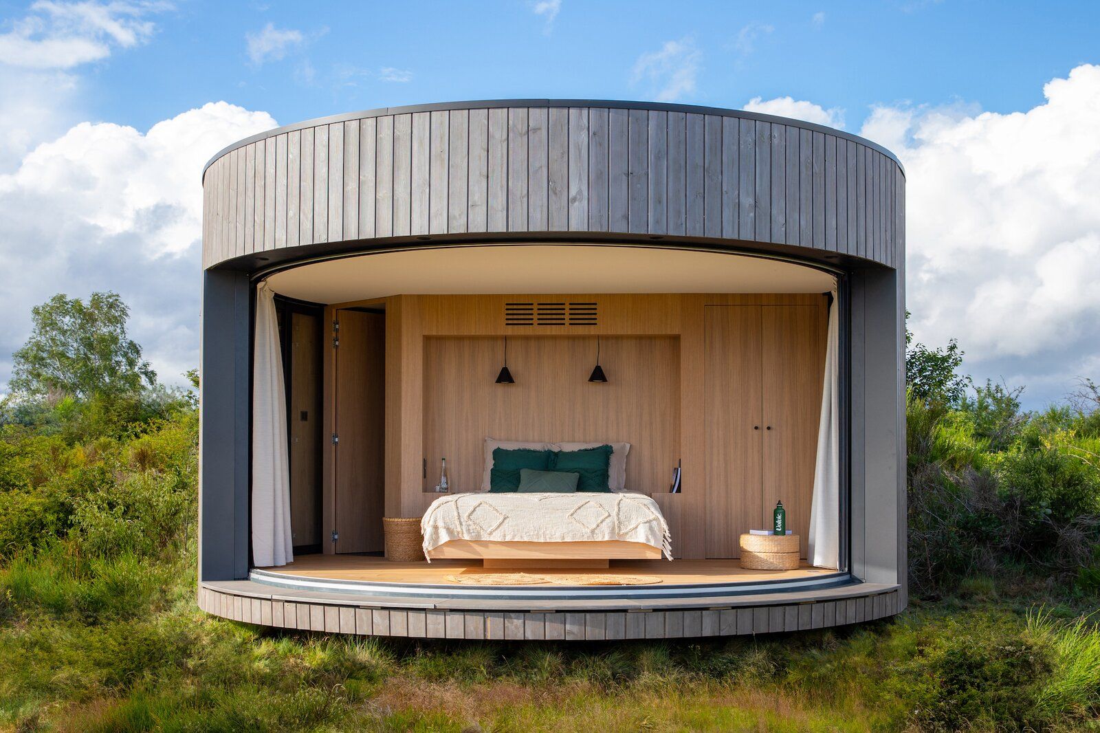 Prefab cabin surrounded by volcanic craters