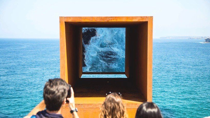 Periscope sculpture reflecting the ocean