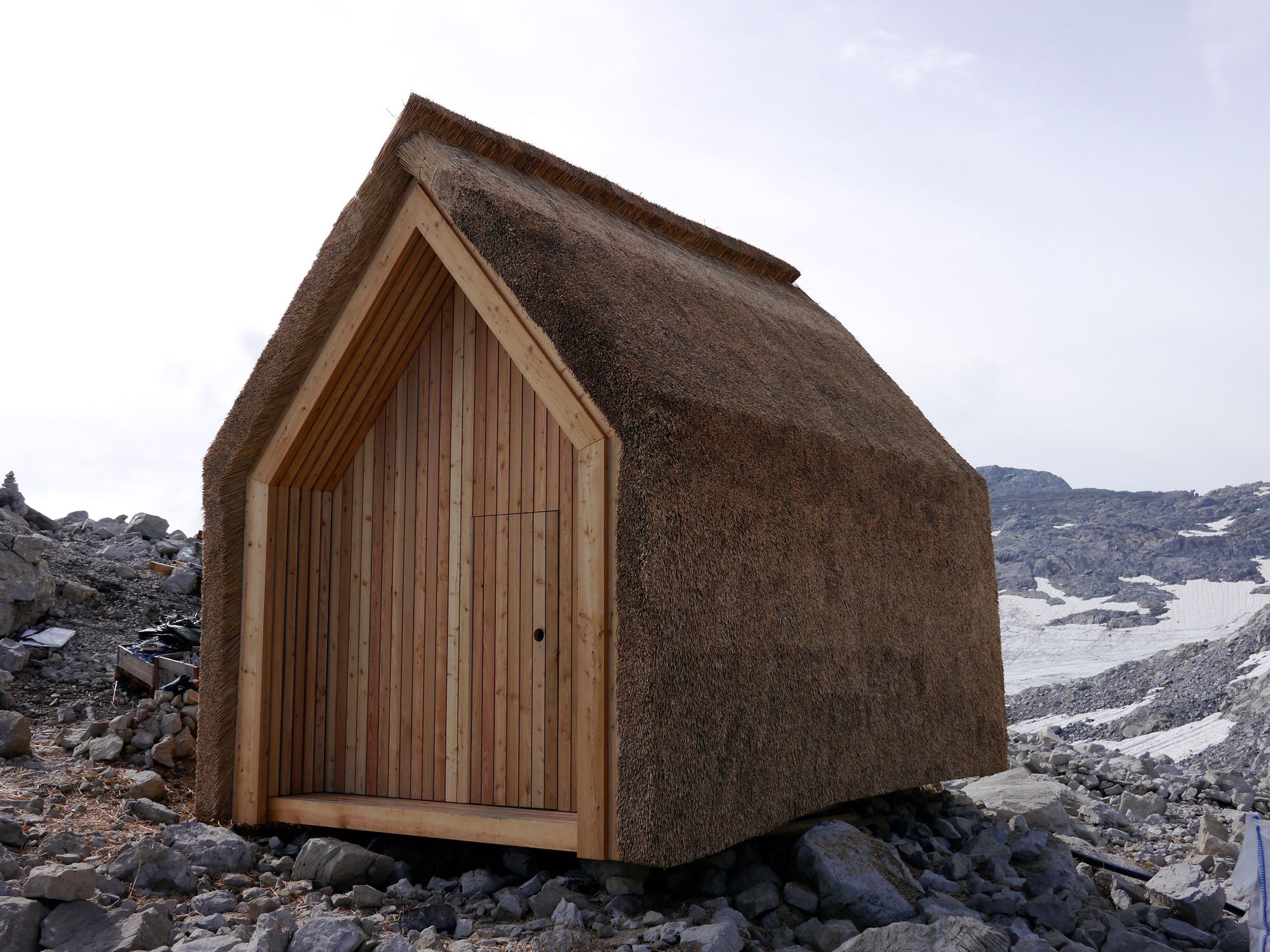 Alpine hut with a thatched roof