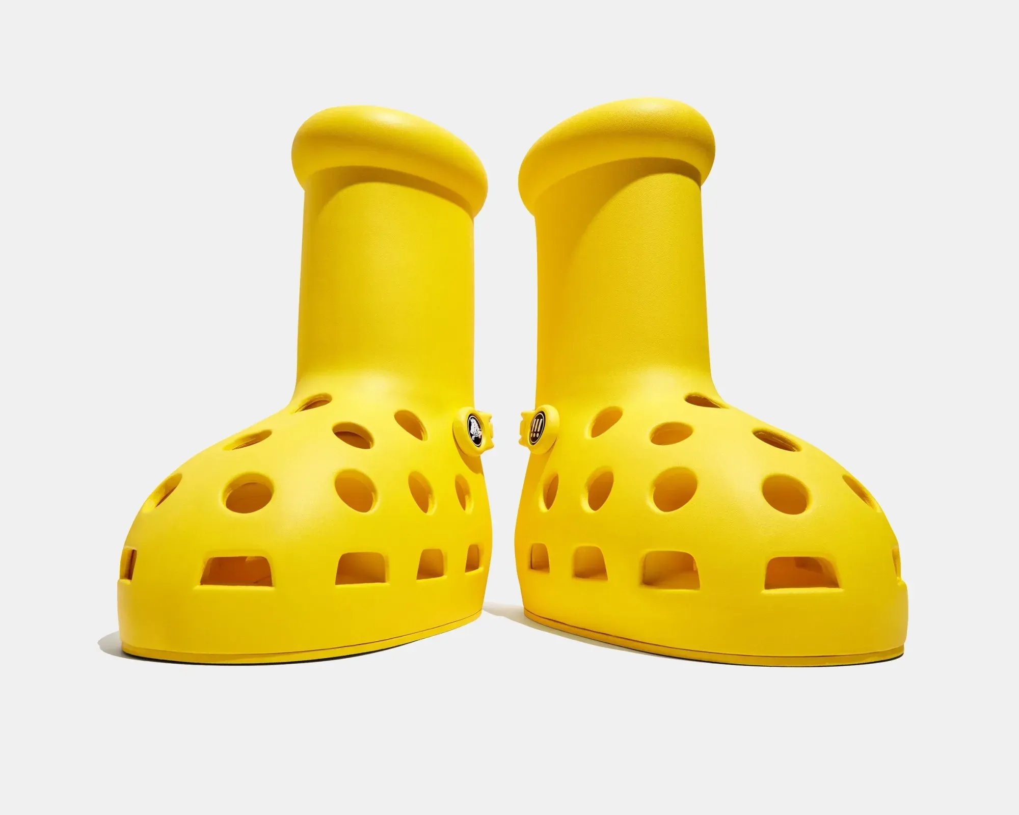 After the big red boots, here come the big yellow boots with holes | MSCHF x Crocs