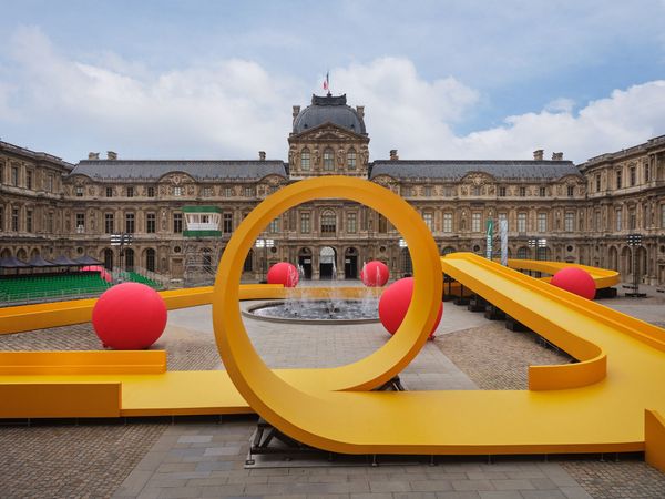 What is a huge playground doing in the courtyard of the Louvre?
